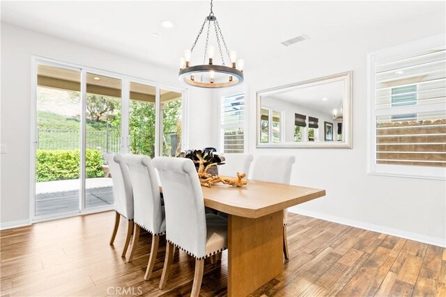 27 Cache St, Rancho Mission Viejo, CA 92694 - dining space featuring a chandelier and wood finished floors