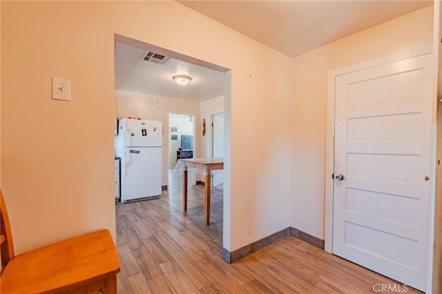 9668 W Rosamond Blvd, Rosamond, CA 93560 - kitchen featuring freestanding refrigerator and light wood-style floors