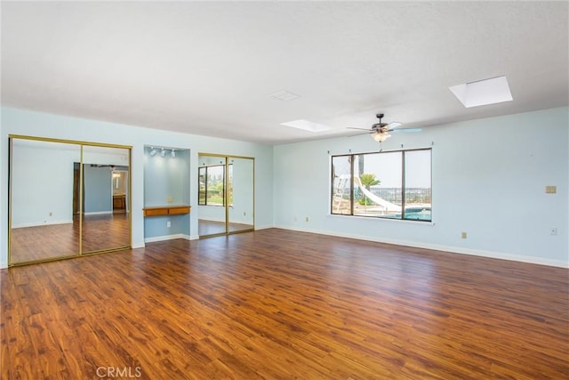 1835 Hilltop Dr, Colton, CA 92324 - spare room with a skylight, wood finished floors, and a ceiling fan