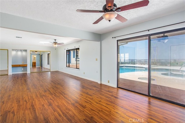 1835 Hilltop Dr, Colton, CA 92324 - unfurnished room with wood finished floors, a ceiling fan, and a textured ceiling