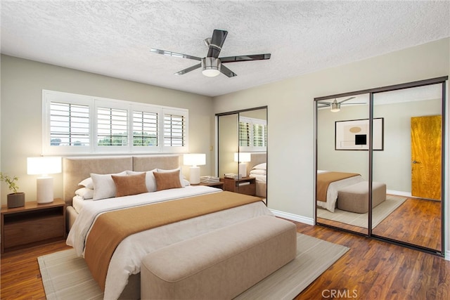 1835 Hilltop Dr, Colton, CA 92324 - bedroom featuring two closets, wood finished floors, a textured ceiling, and a ceiling fan