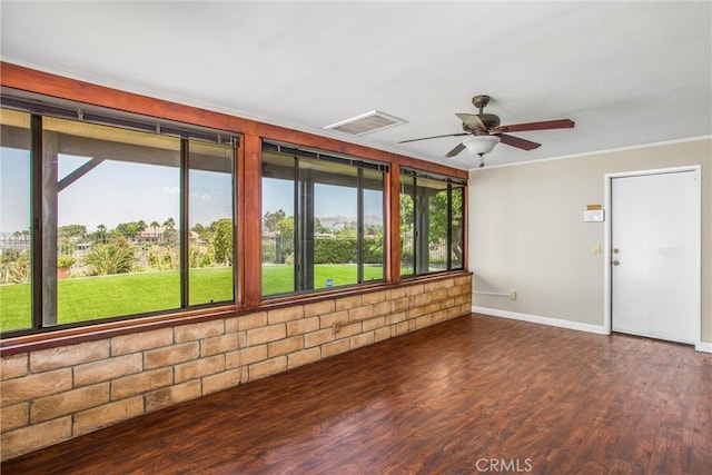 1835 Hilltop Dr, Colton, CA 92324 - unfurnished sunroom featuring plenty of natural light, crown molding, and wood finished floors
