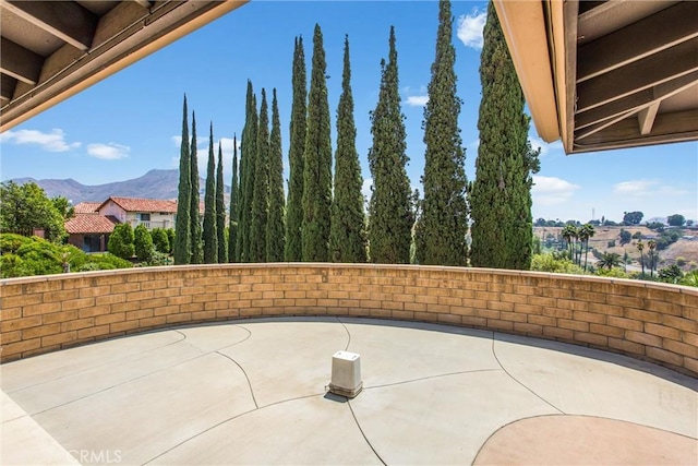 1835 Hilltop Dr, Colton, CA 92324 - view of patio / terrace with a mountain view and basketball hoop