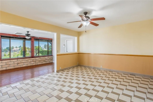 1835 Hilltop Dr, Colton, CA 92324 - spare room featuring a ceiling fan and baseboards