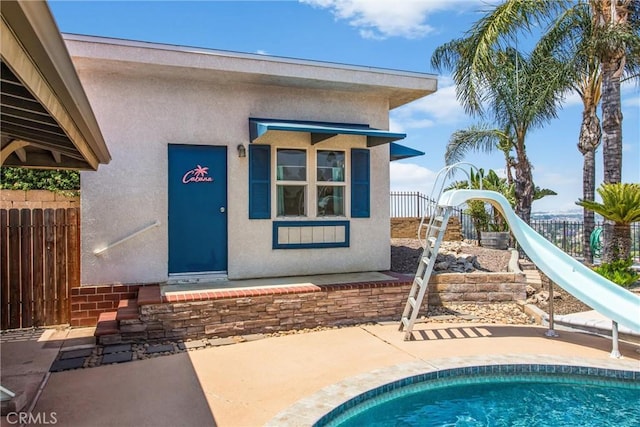 1835 Hilltop Dr, Colton, CA 92324 - property entrance featuring stucco siding and a patio area