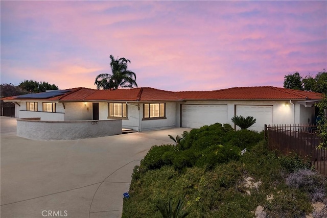 1835 Hilltop Dr, Colton, CA 92324 - single story home with concrete driveway, an attached garage, a tiled roof, and stucco siding