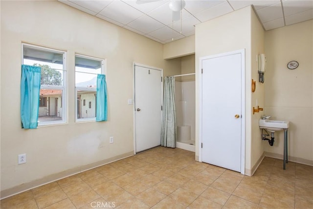 1835 Hilltop Dr, Colton, CA 92324 - unfurnished bedroom with a drop ceiling and light tile patterned floors