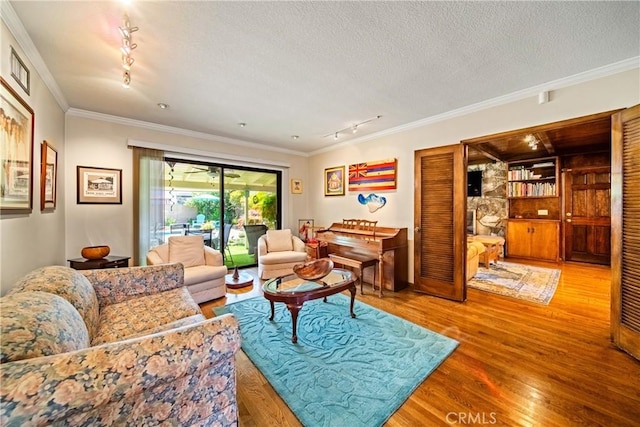 416 N Westridge Ave, Glendora, CA 91741 - living area with rail lighting, wood finished floors, crown molding, and a textured ceiling