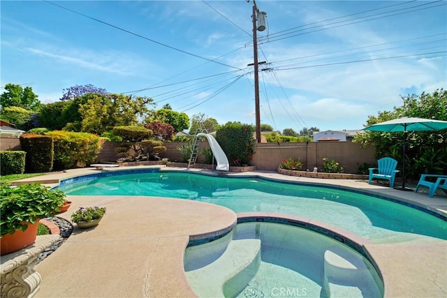 416 N Westridge Ave, Glendora, CA 91741 - view of pool featuring a water slide, a fenced backyard, a pool with connected hot tub, and a patio