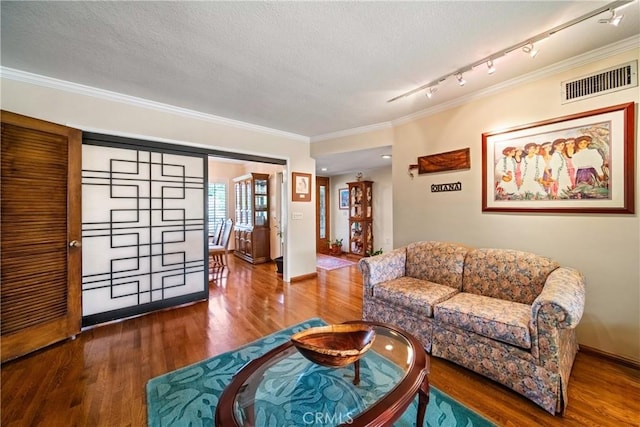 416 N Westridge Ave, Glendora, CA 91741 - living room with crown molding, wood finished floors, a textured ceiling, and track lighting