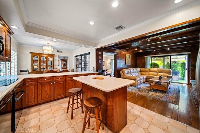 416 N Westridge Ave, Glendora, CA 91741 - kitchen featuring light countertops, a peninsula, a breakfast bar, open floor plan, and recessed lighting