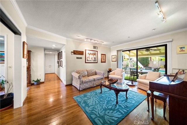 416 N Westridge Ave, Glendora, CA 91741 - living room with rail lighting, wood finished floors, ornamental molding, a textured ceiling, and a ceiling fan