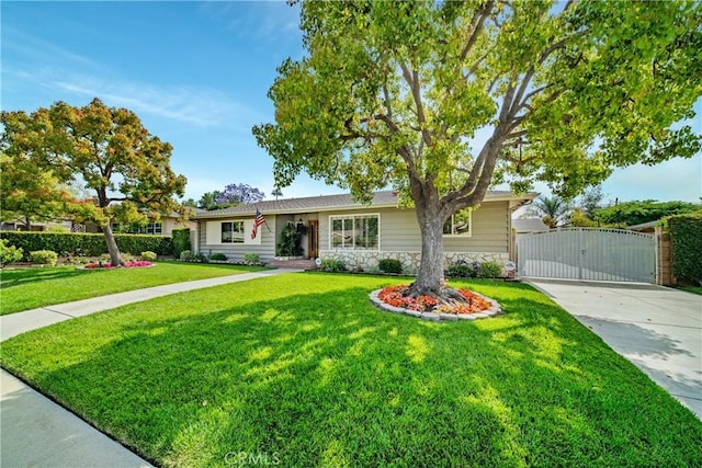 416 N Westridge Ave, Glendora, CA 91741 - ranch-style house featuring a gate, stone siding, a front lawn, and driveway
