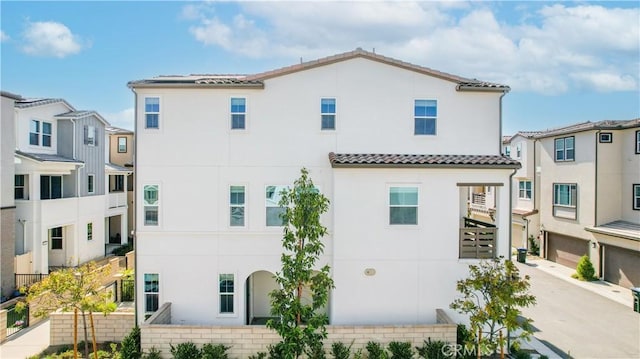 780 Stirrup, Rancho Mission Viejo, CA 92694 - back of house featuring stucco siding, a tile roof, and a residential view