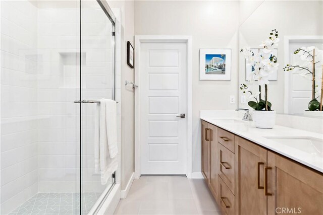 780 Stirrup, Rancho Mission Viejo, CA 92694 - bathroom with a shower stall, double vanity, and tile patterned floors