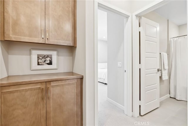 780 Stirrup, Rancho Mission Viejo, CA 92694 - corridor featuring baseboards and light tile patterned flooring