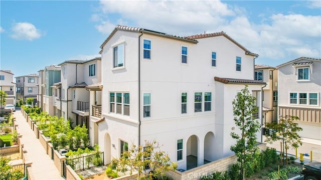780 Stirrup, Rancho Mission Viejo, CA 92694 - rear view of house featuring stucco siding, a residential view, and a tiled roof