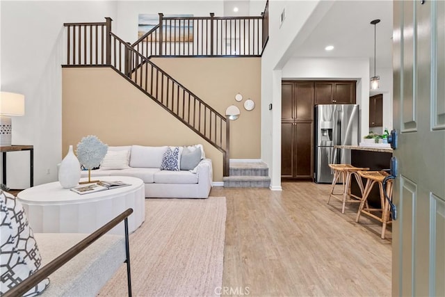 152 Jaripol Cir, Rancho Mission Viejo, CA 92694 - living room with stairs, light wood finished floors, and recessed lighting