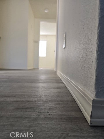 9633 Juniper Ave Unit F2, Fontana, CA 92335 - hallway with wood finished floors and a textured wall
