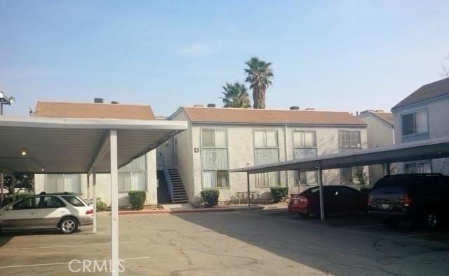 9633 Juniper Ave Unit F2, Fontana, CA 92335 - covered parking lot featuring stairway