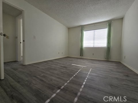 9633 Juniper Ave Unit F2, Fontana, CA 92335 - empty room featuring a textured ceiling and wood finished floors