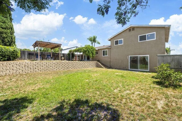 310 Michele Dr, Vista, CA 92084 - fenced backyard with a pergola and stairs