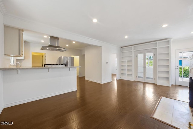 1430 Pepper Dr, Pasadena, CA 91104 - unfurnished living room featuring wood finished floors, crown molding, french doors, built in features, and recessed lighting