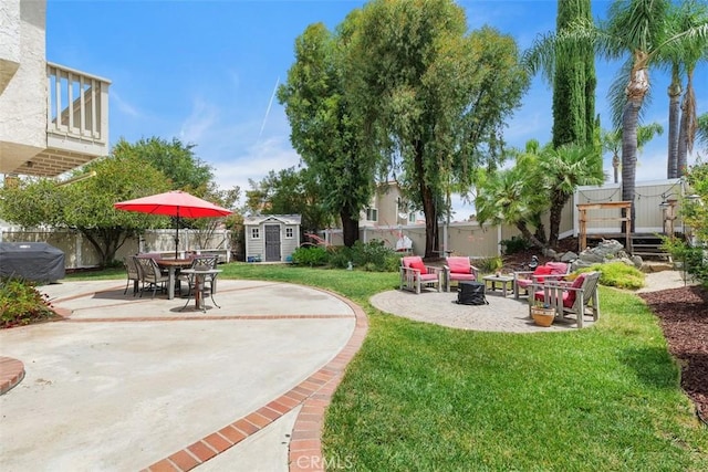 45620 Hopactong St, Temecula, CA 92592 - fenced backyard featuring a storage unit, a patio, a fire pit, and outdoor dining space