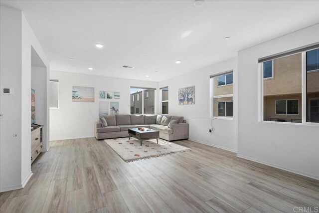 5265 Beachfront Cove St Unit 167, San Diego, CA 92154 - living room featuring light wood-style flooring and recessed lighting