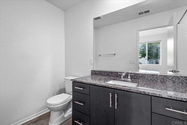 5265 Beachfront Cove St Unit 167, San Diego, CA 92154 - bathroom with wood finished floors and vanity