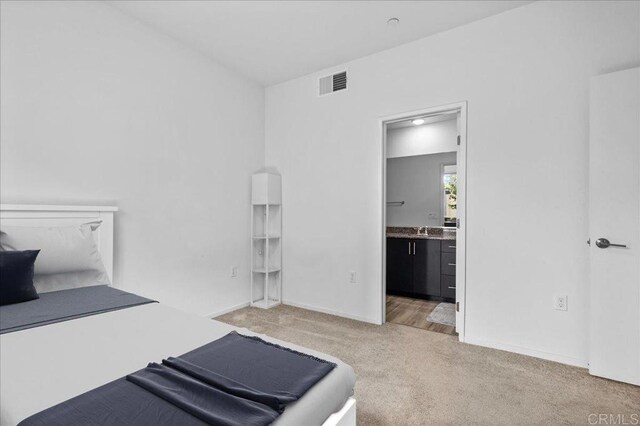 5265 Beachfront Cove St Unit 167, San Diego, CA 92154 - bedroom featuring light carpet and ensuite bathroom