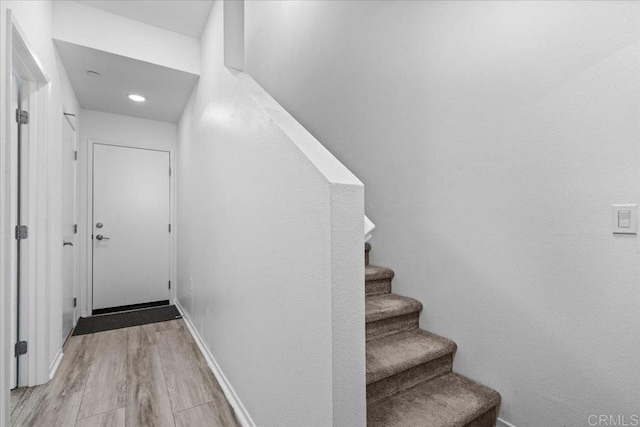 5265 Beachfront Cove St Unit 167, San Diego, CA 92154 - staircase featuring wood finished floors and baseboards