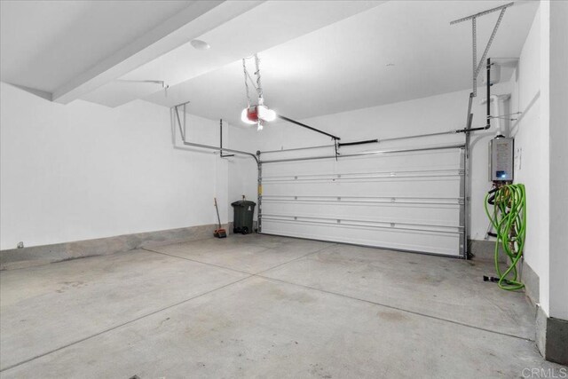 5265 Beachfront Cove St Unit 167, San Diego, CA 92154 - garage featuring a garage door opener