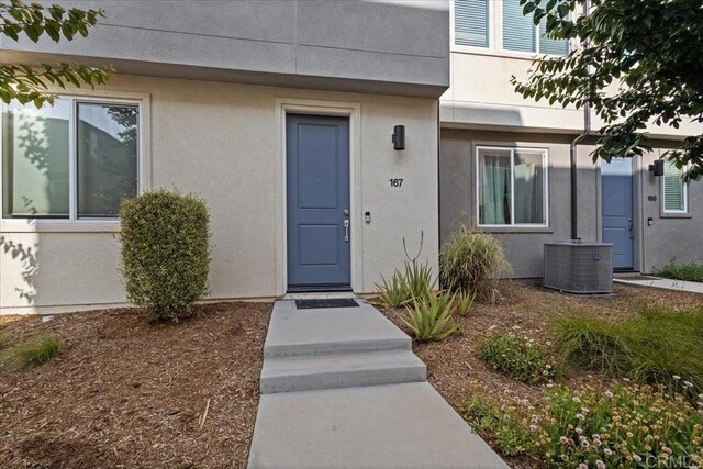 5265 Beachfront Cove St Unit 167, San Diego, CA 92154 - view of exterior entry featuring stucco siding