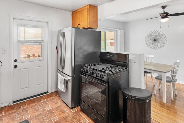2842 E 18th St, National City, CA 91950 - kitchen with gas stove, plenty of natural light, a ceiling fan, and freestanding refrigerator