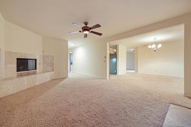 2814 Helix St, Spring Valley, CA 91977 - unfurnished living room featuring light carpet, a tiled fireplace, and a chandelier