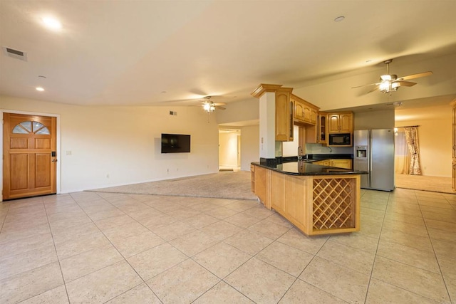 2814 Helix St, Spring Valley, CA 91977 - kitchen featuring stainless steel fridge with ice dispenser, black microwave, a ceiling fan, light tile patterned floors, and vaulted ceiling