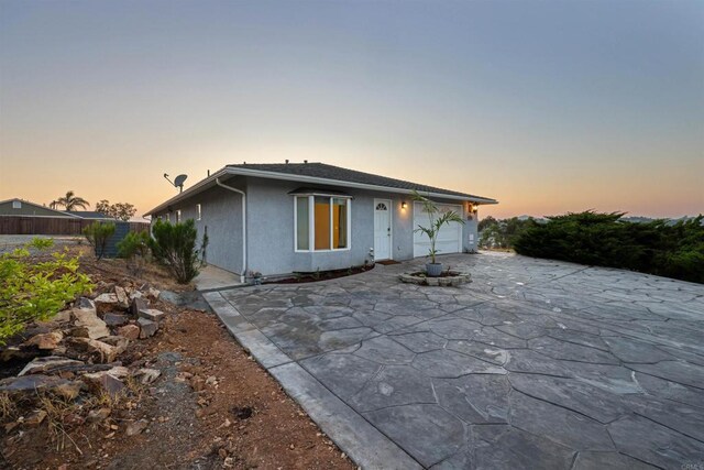 2814 Helix St, Spring Valley, CA 91977 - view of front facade with an attached garage and stucco siding