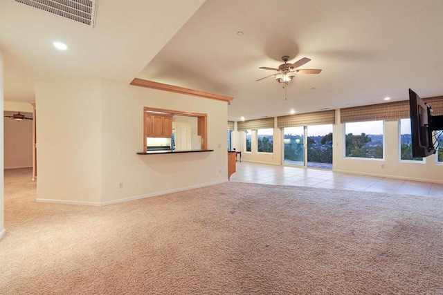 2814 Helix St, Spring Valley, CA 91977 - unfurnished living room featuring ceiling fan, light colored carpet, healthy amount of natural light, recessed lighting, and light tile patterned floors