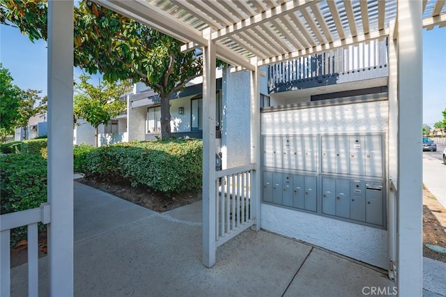 20821 E Calora St Unit E1, Covina, CA 91724 - view of patio / terrace with mail area and a pergola