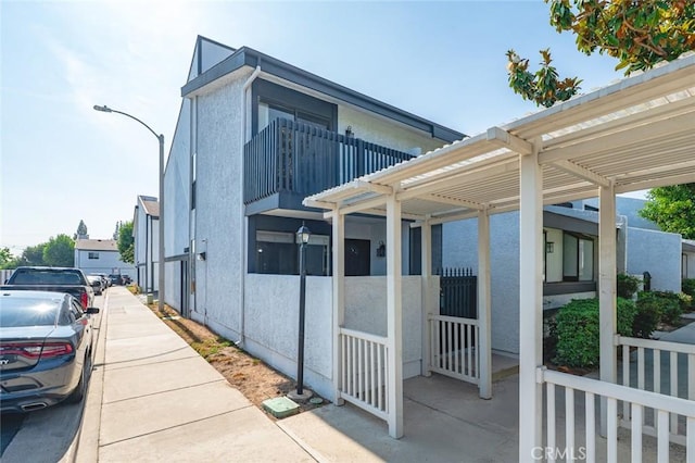 20821 E Calora St Unit E1, Covina, CA 91724 - view of side of property with stucco siding and a balcony