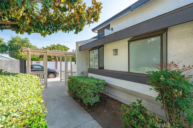 20821 E Calora St Unit E1, Covina, CA 91724 - view of side of home featuring stucco siding