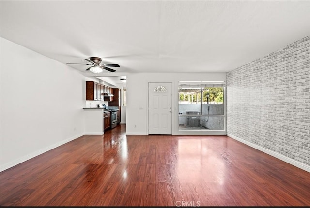20821 E Calora St Unit E1, Covina, CA 91724 - unfurnished living room with a ceiling fan, dark wood-style floors, and brick wall