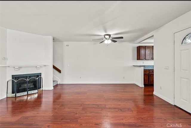 20821 E Calora St Unit E1, Covina, CA 91724 - unfurnished living room with ceiling fan, wood finished floors, stairway, and a fireplace