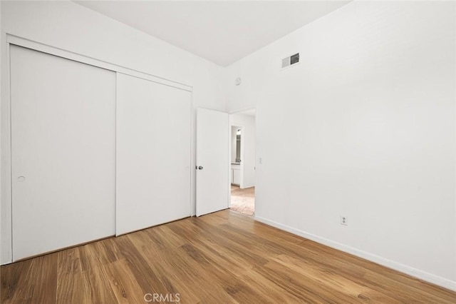 20821 E Calora St Unit E1, Covina, CA 91724 - unfurnished bedroom featuring wood finished floors and a closet