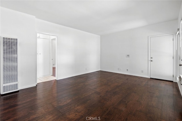 3604 Cortez St, Riverside, CA 92504 - empty room featuring a heating unit and wood finished floors