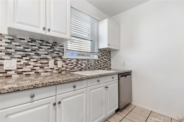 3604 Cortez St, Riverside, CA 92504 - kitchen featuring dishwasher, white cabinetry, decorative backsplash, light tile patterned floors, and light stone countertops