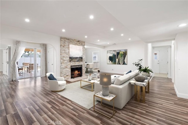 11440 Gothic Ave, Granada Hills, CA 91344 - living room with wood finished floors, recessed lighting, and a stone fireplace