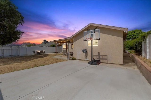 11440 Gothic Ave, Granada Hills, CA 91344 - back of house featuring stucco siding, a fenced backyard, and a patio