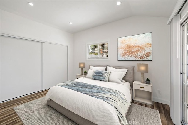11440 Gothic Ave, Granada Hills, CA 91344 - bedroom featuring dark wood-style floors, vaulted ceiling, a closet, and recessed lighting